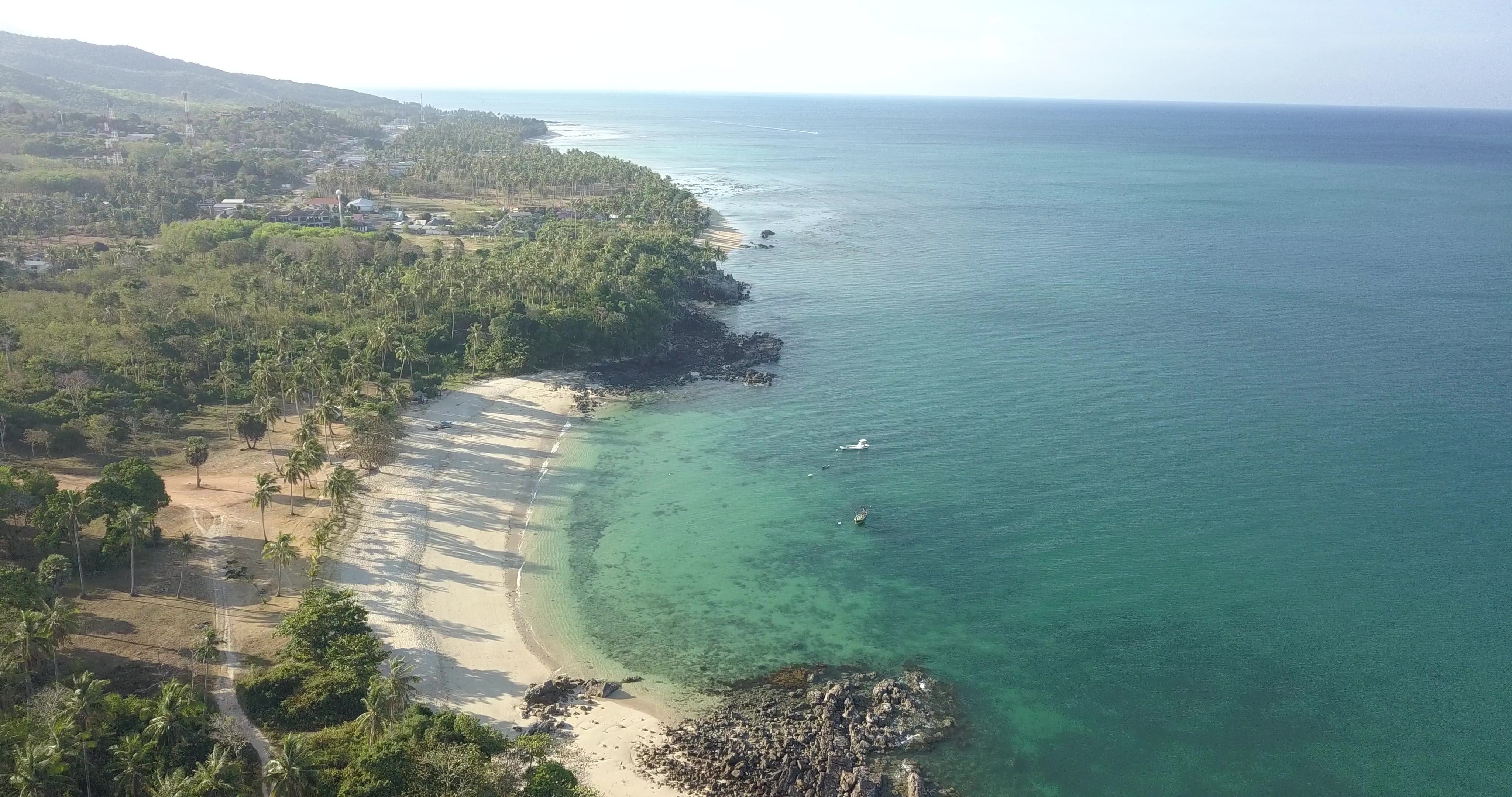 aerial drone view of a winding coastal road